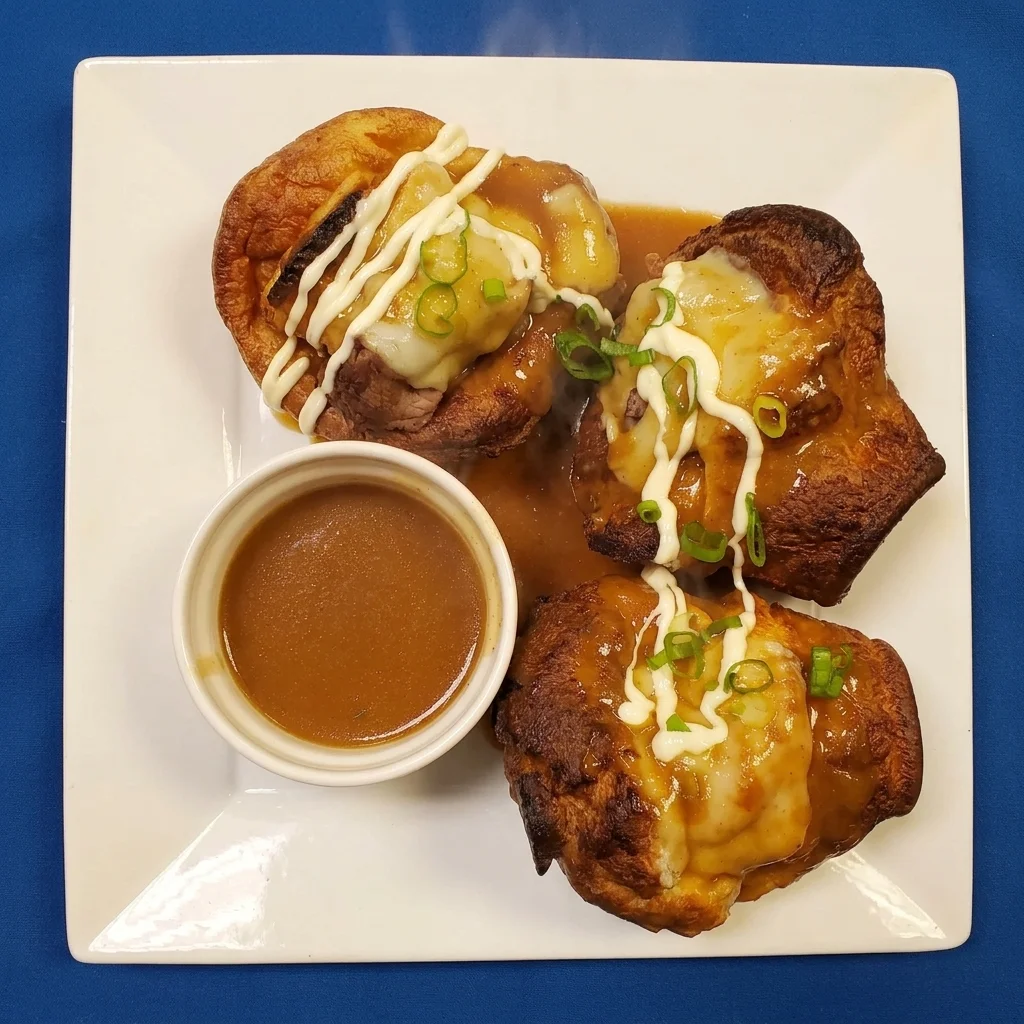Stuffed Yorkies - Yorkshire puddings filled with roast beef and mashed potato, topped with gravy and green onion at Cheryl's Country Kitchen in Airdrie, AB