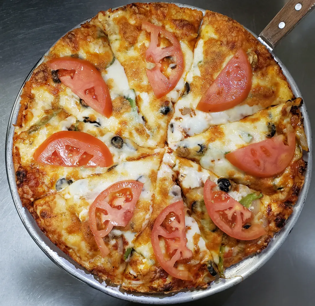 Greek Pizza - Vegetarian pizza with tomato, olives, peppers and feta at Cheryl's Country Kitchen in Airdrie