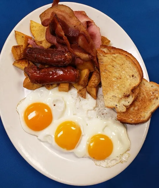 Harvest Breakfast with three eggs, bacon, ham and sausage at Cheryl's Country Kitchen near Bayside, Airdrie