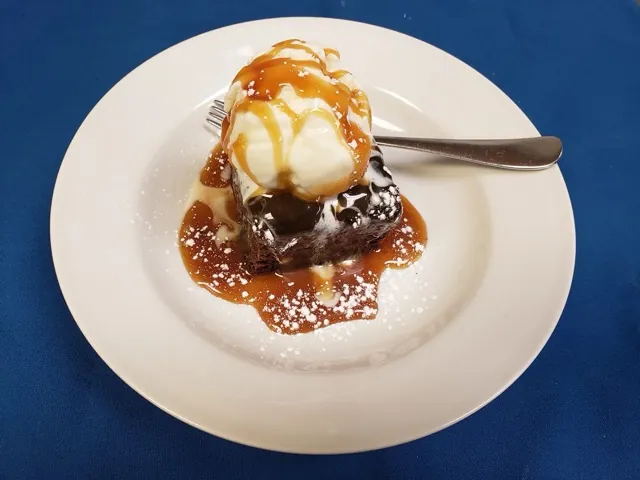 Sticky toffee pudding dessert with vanilla ice cream at Cheryl's Country Kitchen in Airdrie