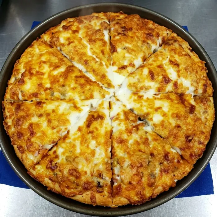 House-made pan cheese pizza baked golden and cut into six slices