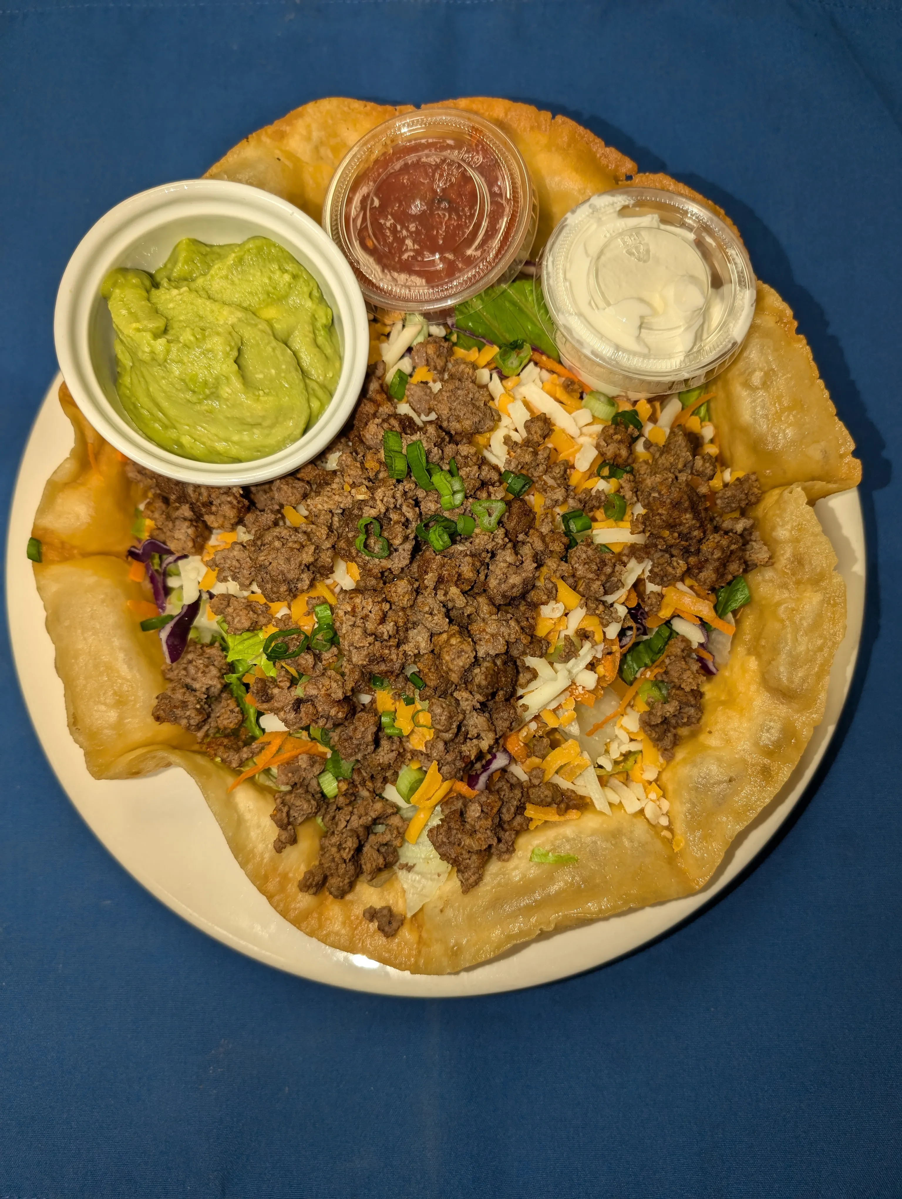 Taco salad in a crisp edible bowl with seasoned beef, cheese, salsa and sour cream at Cheryl's Country Kitchen near Bayside, Airdrie